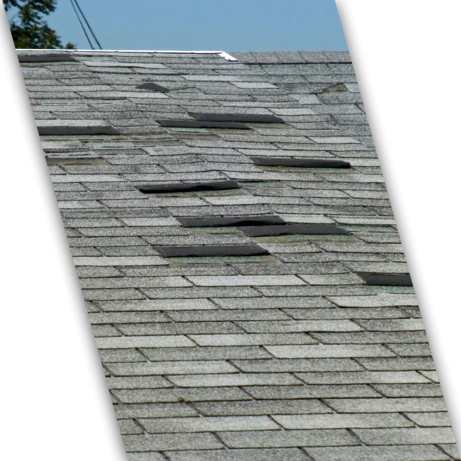 close up of a damaged shingle roof before storm damage roofing repair services aberdeen wa